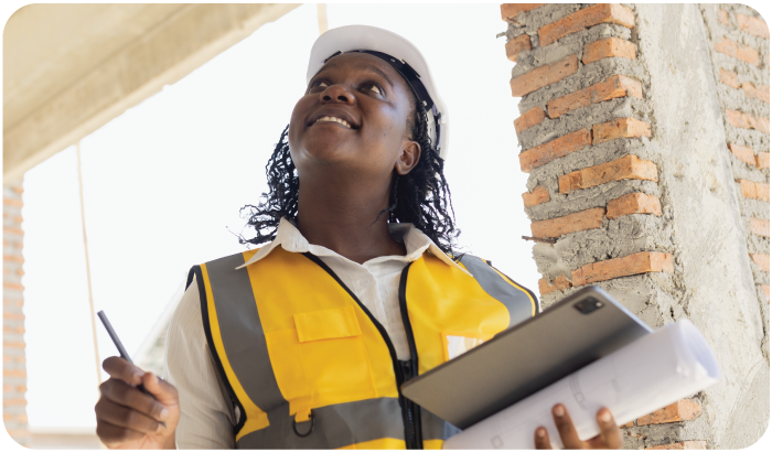 A Contractor Inspecting a Building